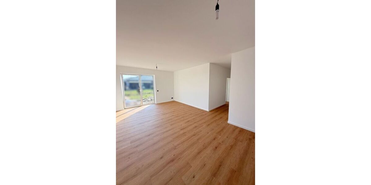 Wohnzimmer mit Zugang zur Terrasse